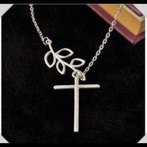 Beautiful silver leaf and cross necklace.